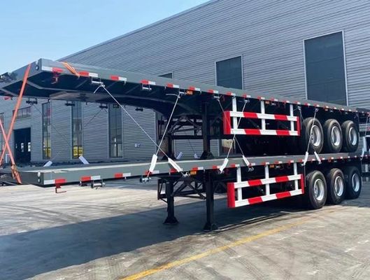 Максимальная полезная нагрузка Wosheng 30000 кг 3 оси 4 оси Стальной контейнер Плоская кровать полуприцеп
